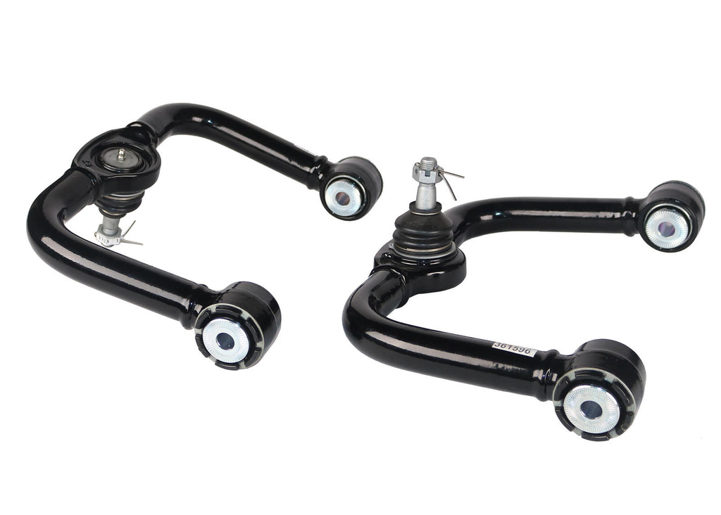 Bracci di controllo superiori anteriori Whiteline per Nissan Navara D40, D23 e Pathfinder R51 — confezione completa